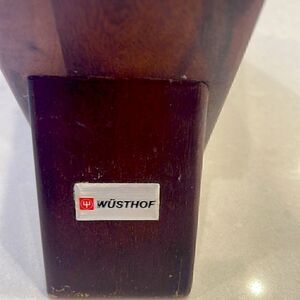 Wusthof knife block room for 5 knives and scissor slot nice for the countertop.